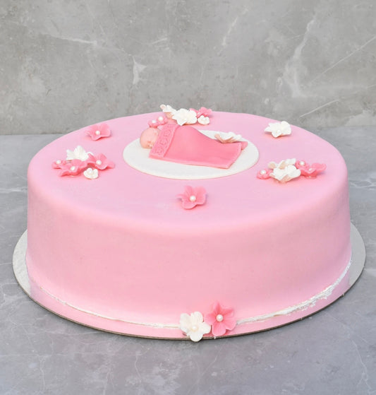Rosa tårta m. blommor & bebis